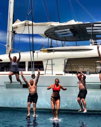 People jumping off yacht