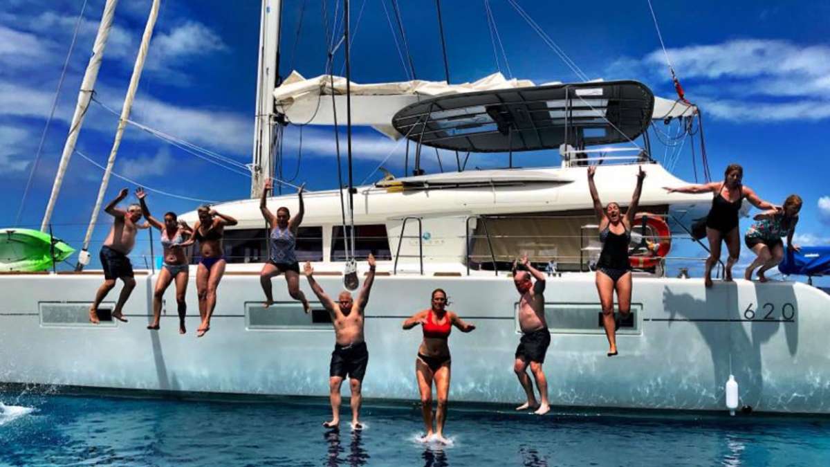 People jumping off yacht